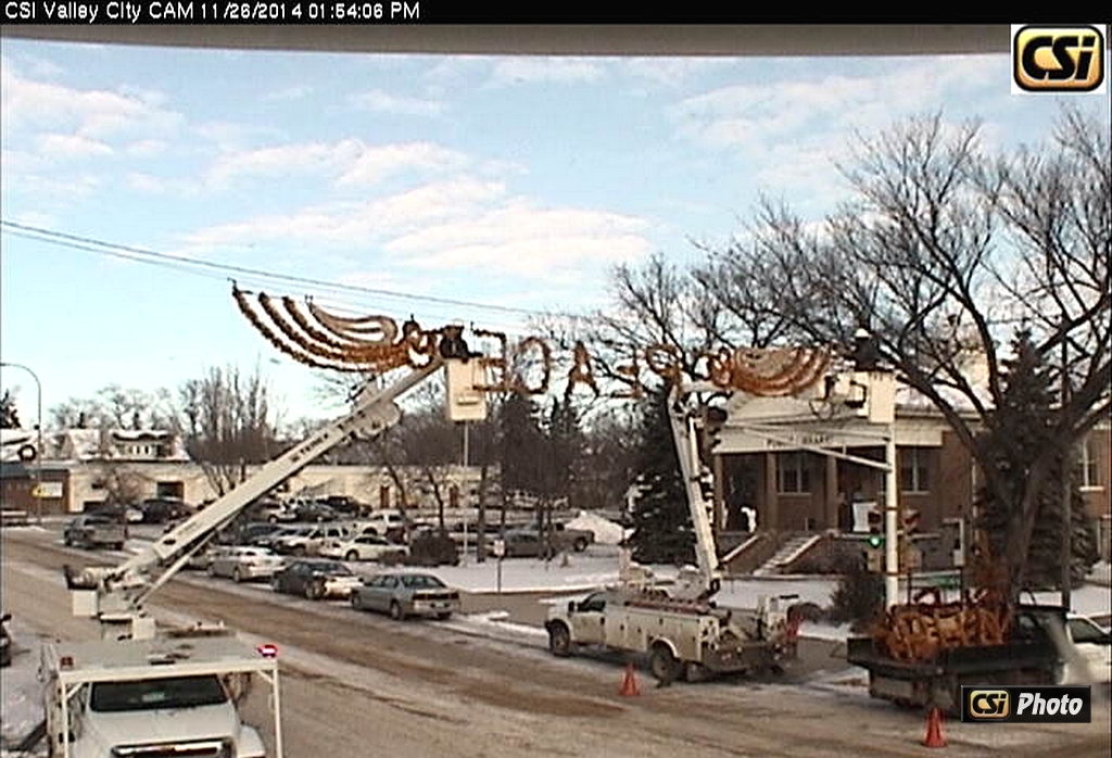 Crews Set Christmas Decorations in Downtown Valley City